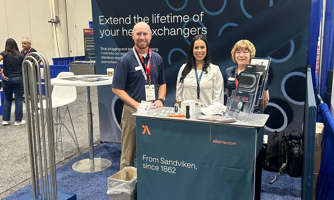 a group of people standing at a booth