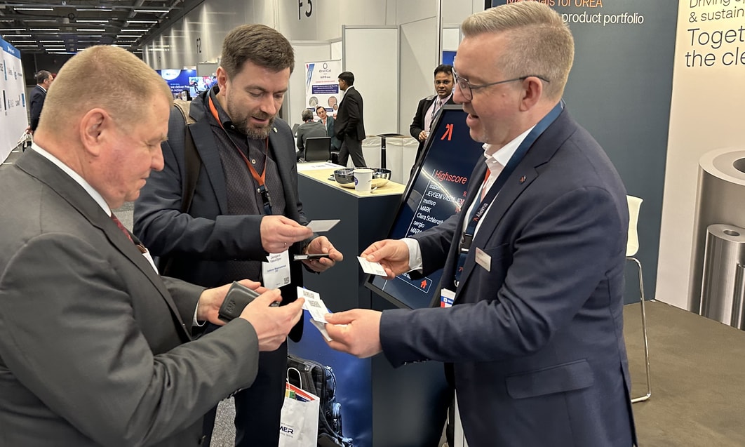 a group of men in suits at a convention