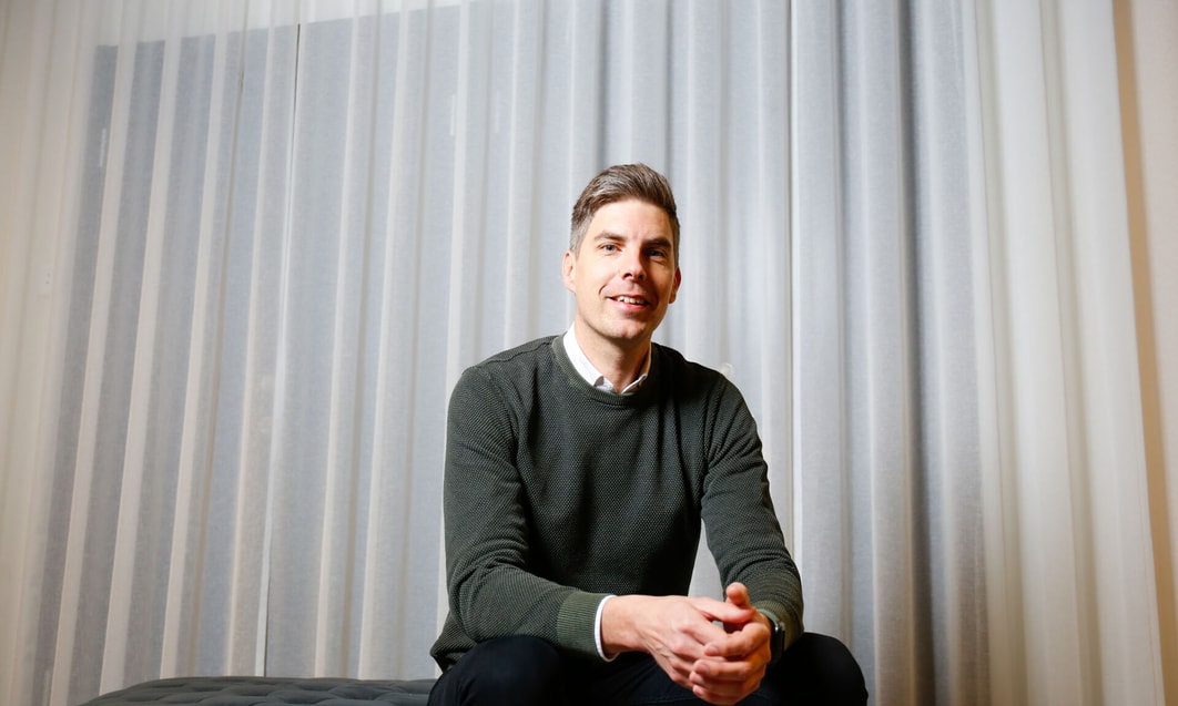 a person sitting on a bed