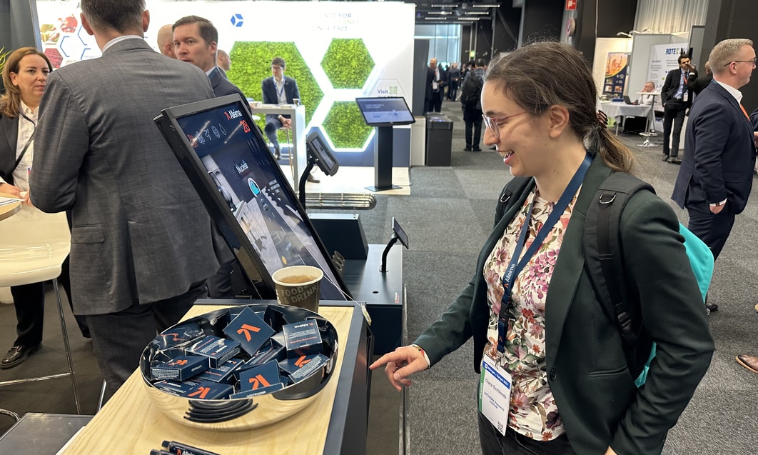 a person pointing at a computer screen