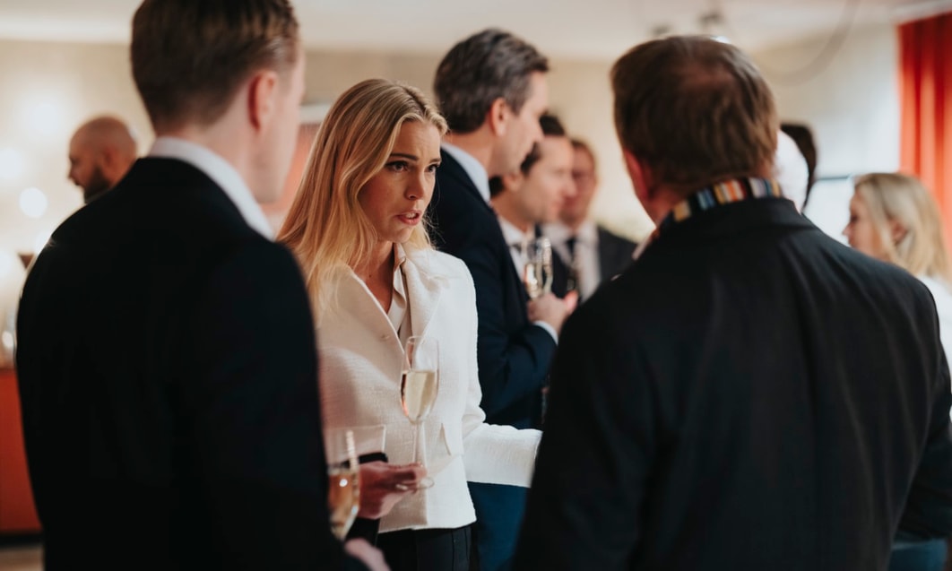 a group of people standing in a room