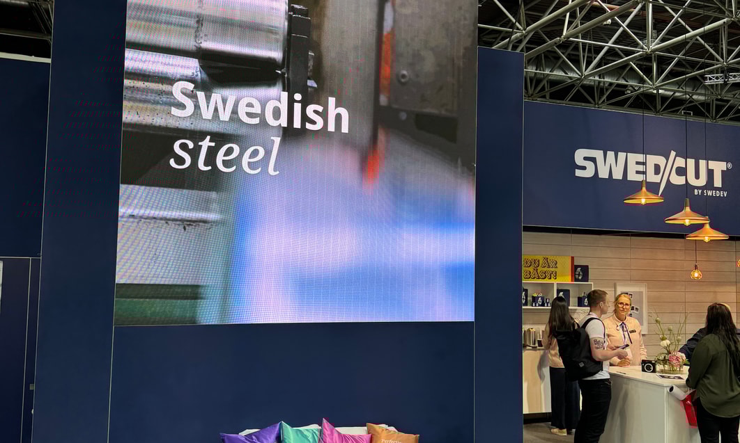 a room with a bed and a large screen