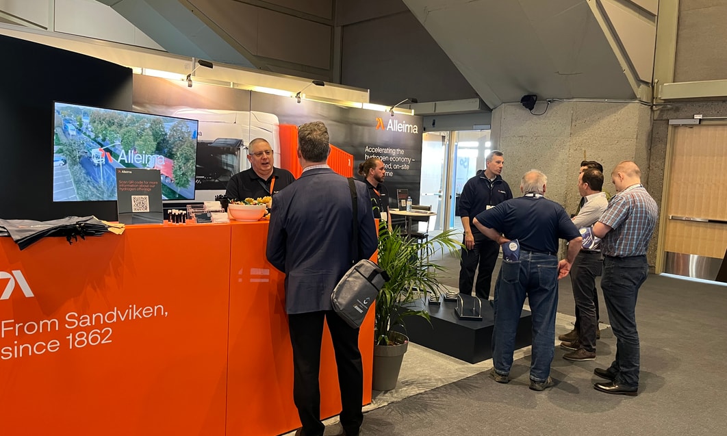 a group of people standing around a counter