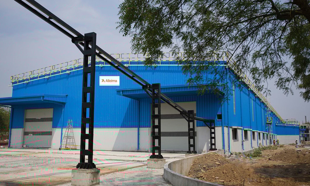 a blue building with metal structures