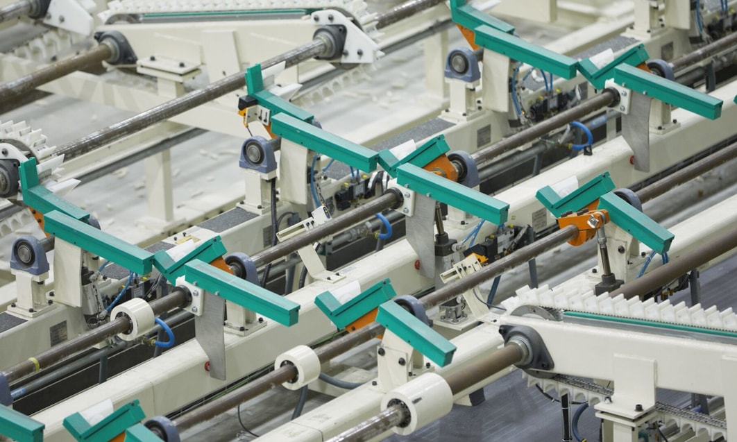 a group of machines with green handles