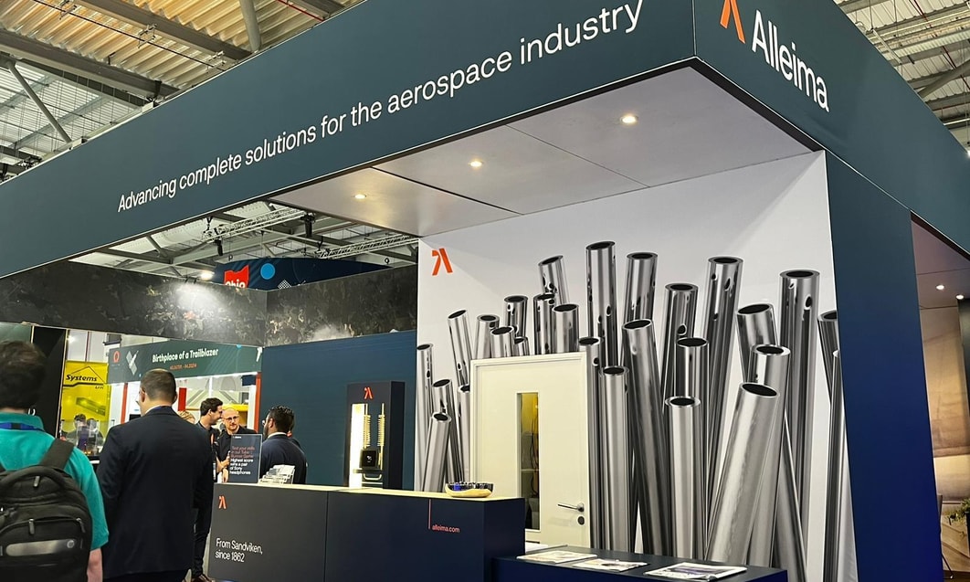 a group of people standing in front of a booth