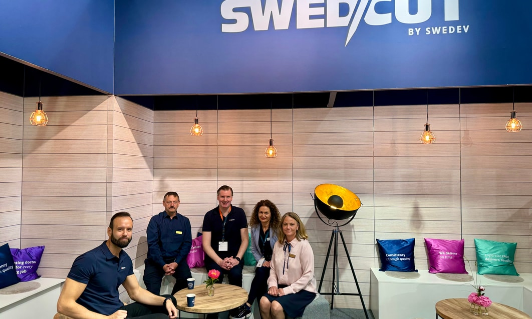 a group of people sitting at tables