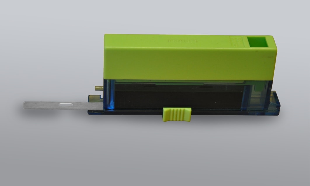 a green and blue pencil sharpener