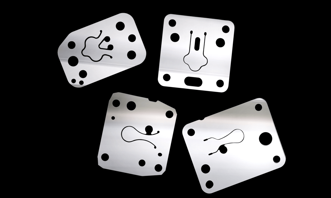 a group of metal plates with holes