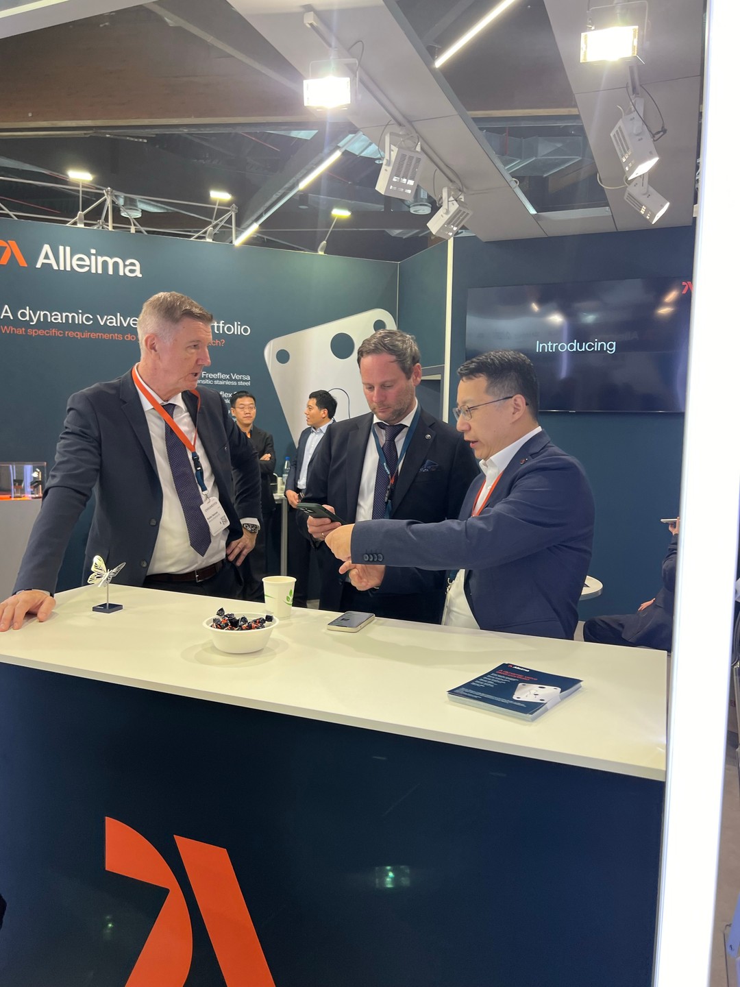 a group of men standing at a counter