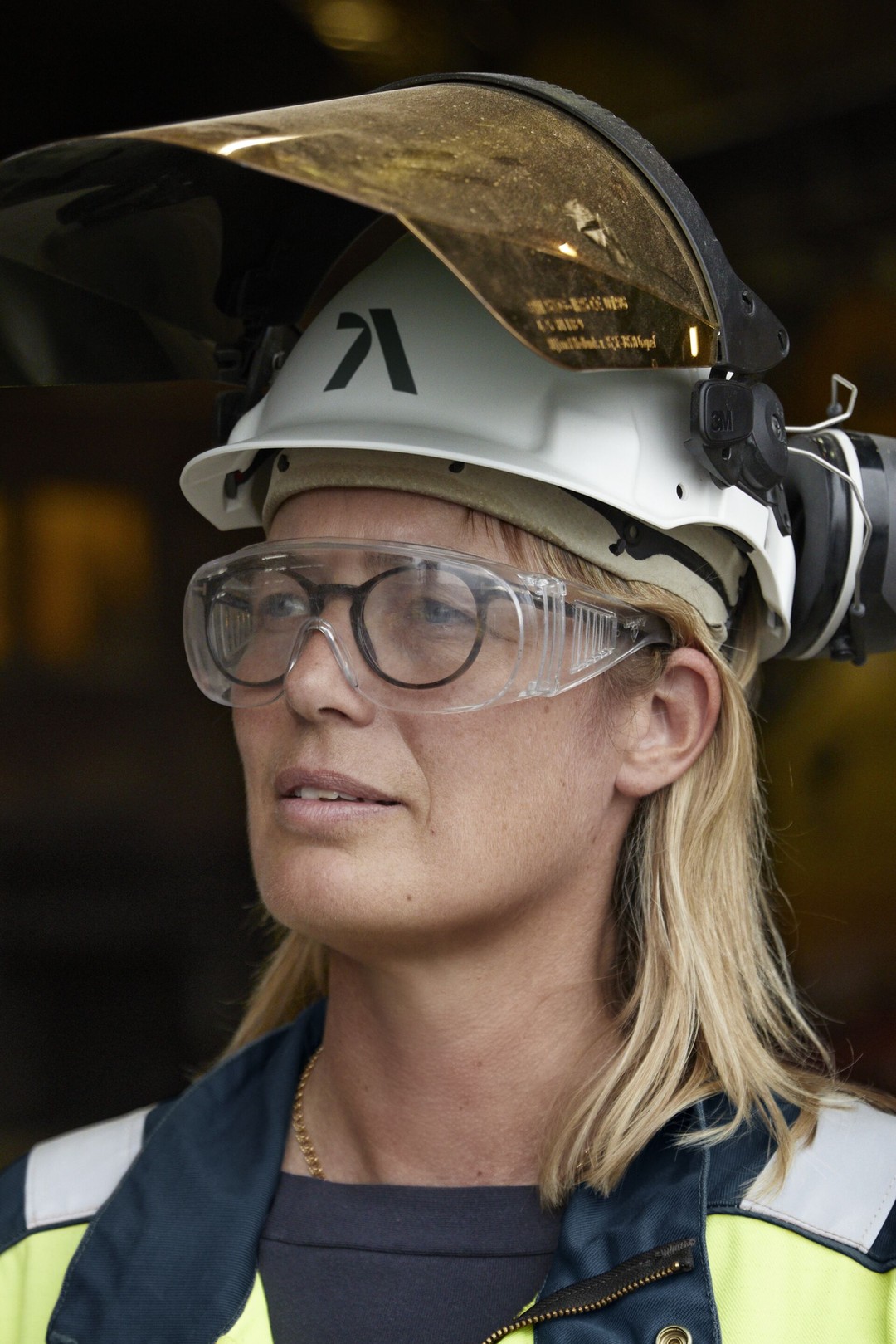 a person wearing a hard hat and goggles
