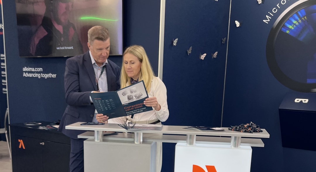 a person and person looking at a brochure