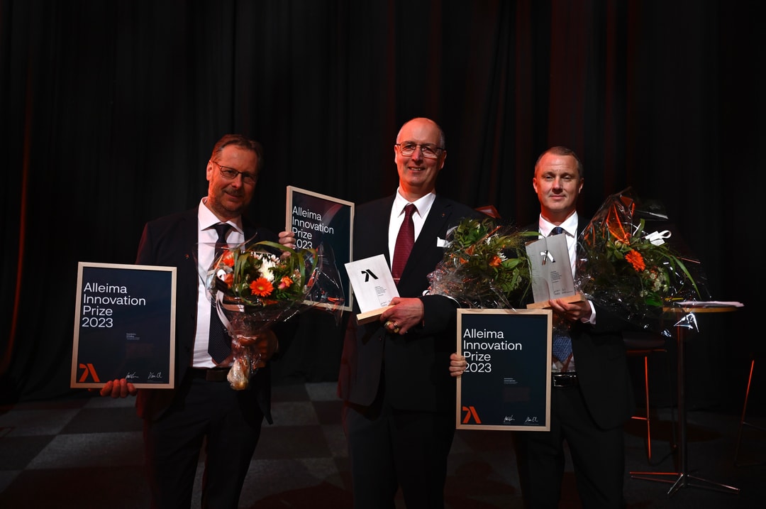 a group of men holding signs and flowers