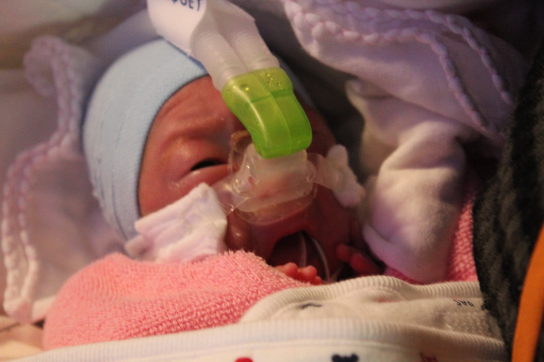 a baby with an oxygen mask
