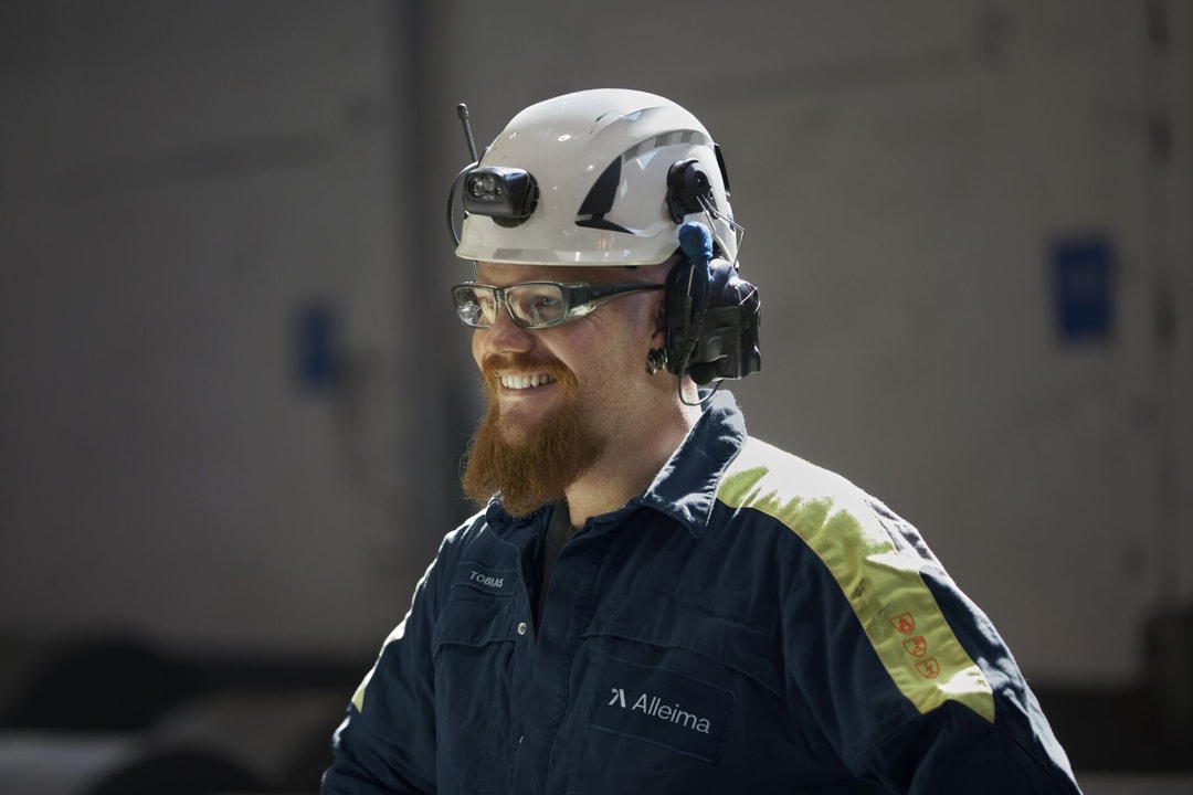 a person wearing a helmet and a hard hat
