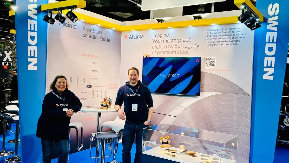 a person and person standing in front of a booth