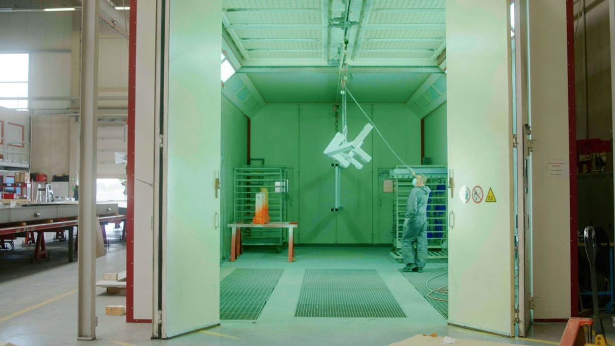 a person standing in a room with a crane