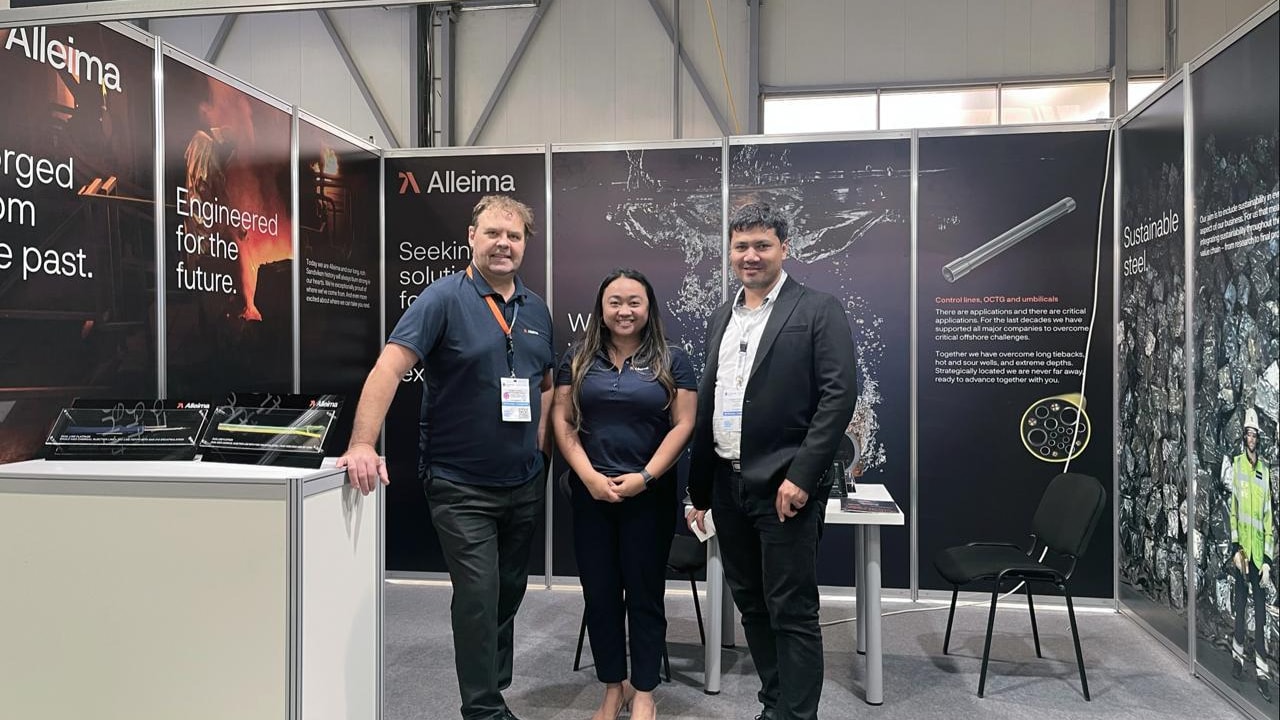 a group of people standing in front of a display