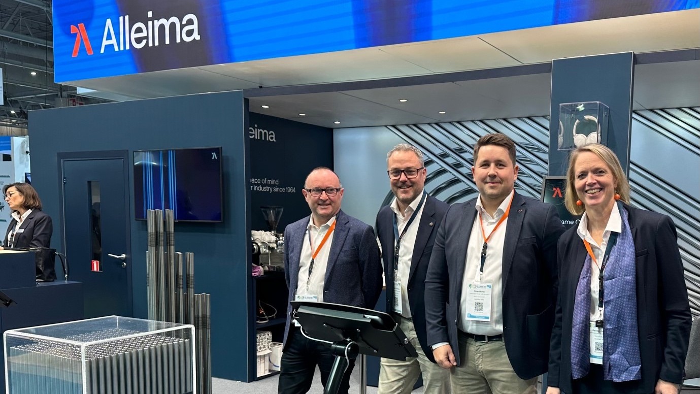 a group of people standing in front of a sign