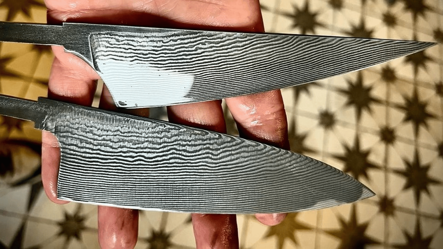 a person holding two knives