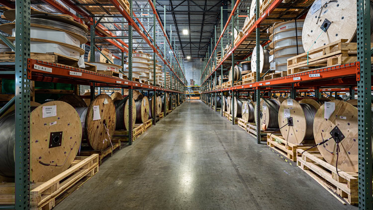 a warehouse with lots of rolls of wire