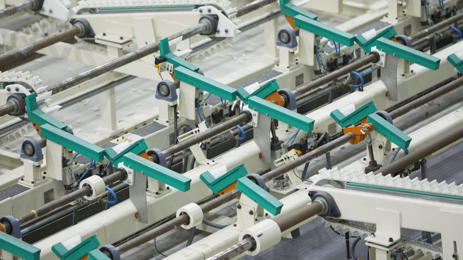 a group of machines with green handles