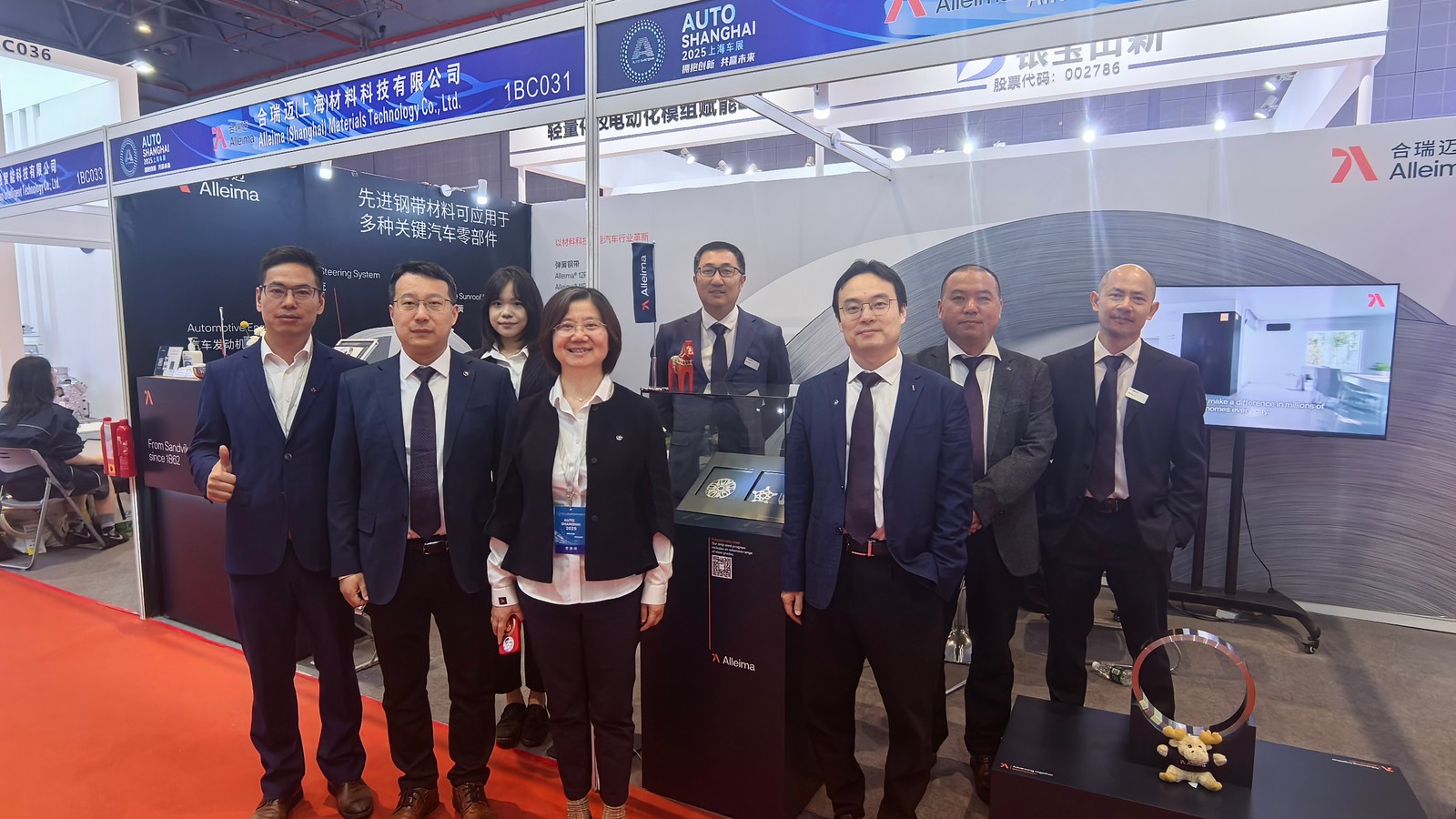 a group of people standing in front of a display