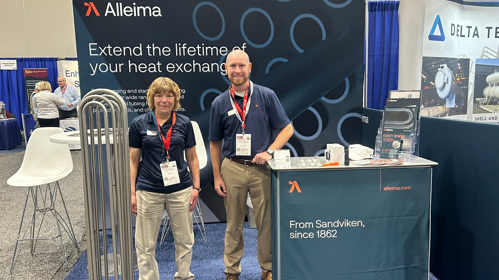 a couple of people standing in front of a display