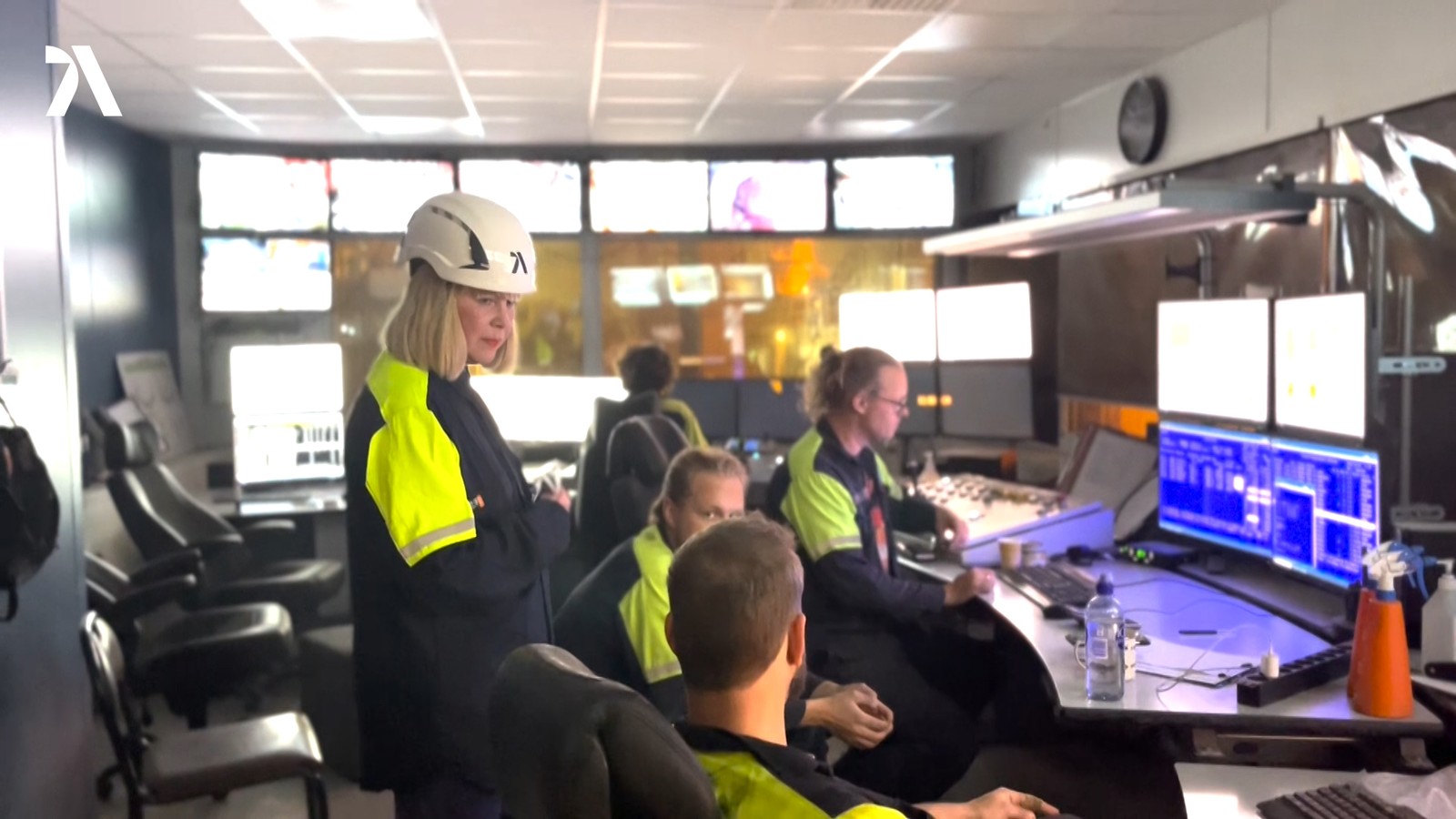 a group of people in a control room