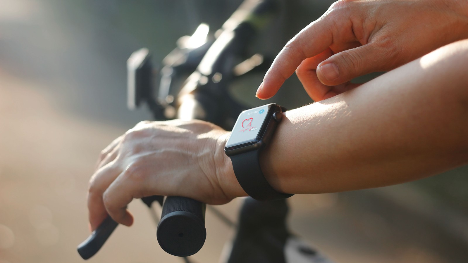 a person using a smart watch on a bicycle