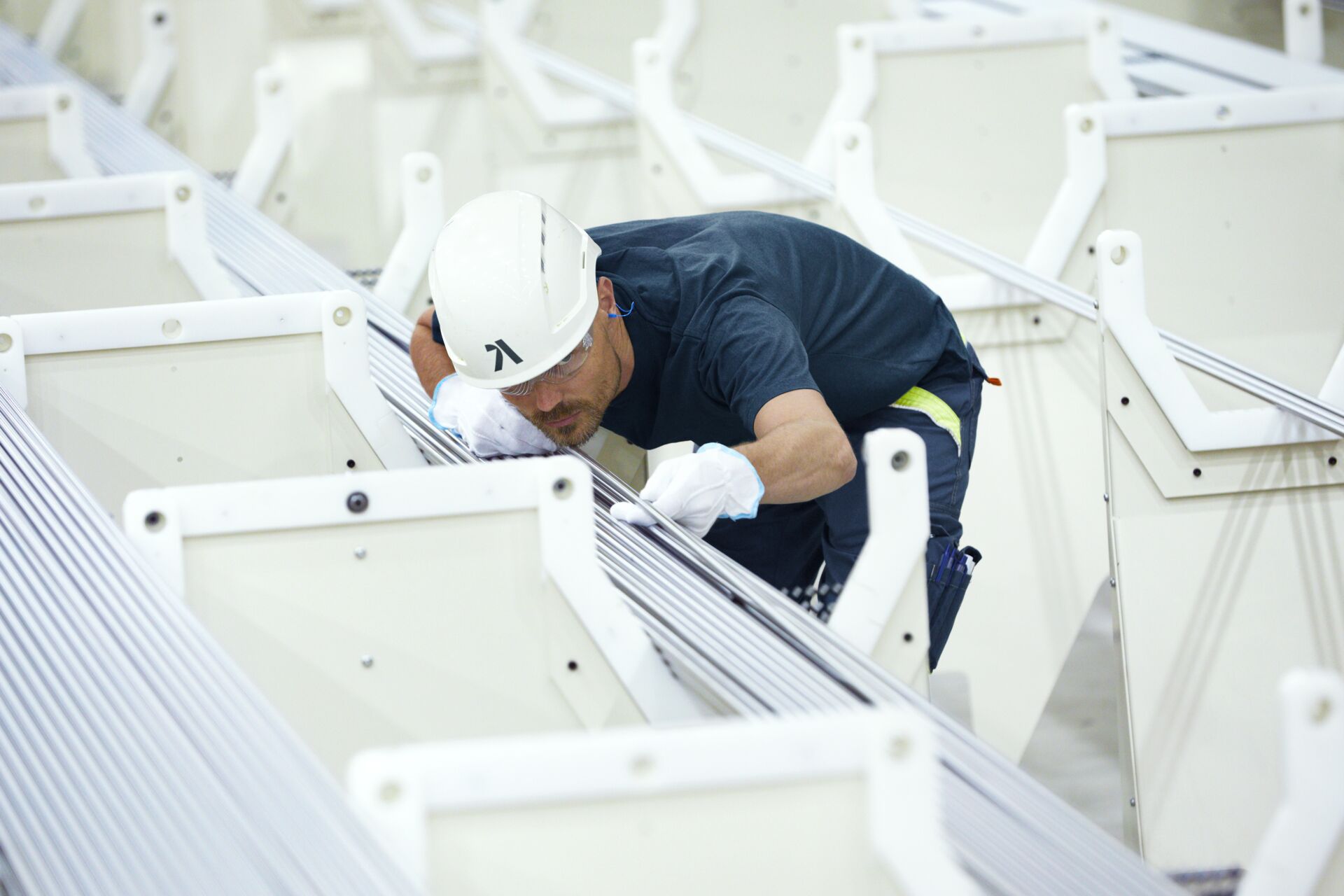 a person wearing a hard hat and gloves