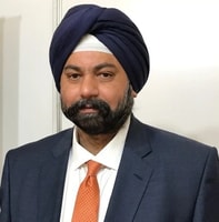 a person in a suit and turban