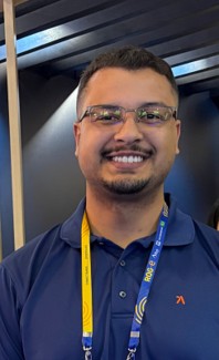 a person wearing glasses and a blue shirt