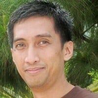 a person smiling at the camera