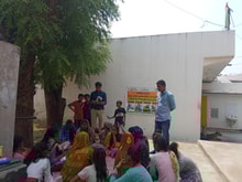 a group of people sitting outside