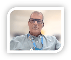 a person wearing glasses and a lanyard