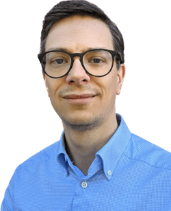 a person wearing glasses and a blue shirt