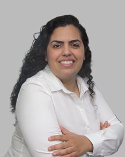 a person with long hair wearing a white shirt