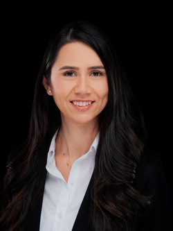 a person with long hair smiling