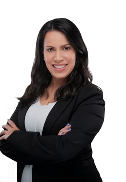 a person with dark hair wearing a black jacket