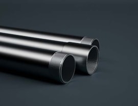 several metal pipes with a black background