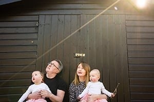 a group of people sitting on a bench