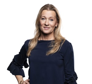 a person with blonde hair wearing a blue shirt