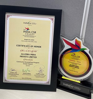 a certificate and award next to a statue