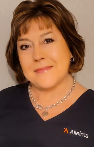 a person wearing a necklace and earrings