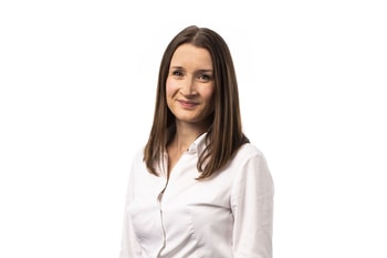 a person with long brown hair wearing a white shirt