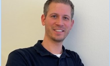 a person smiling at the camera