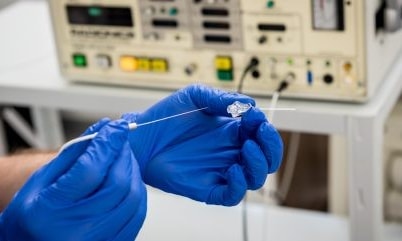 a person holding a needle