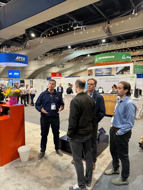 a group of people standing in a room with a variety of signs