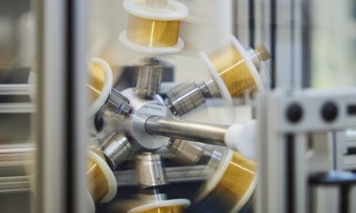 a spinning machine with spools of wire